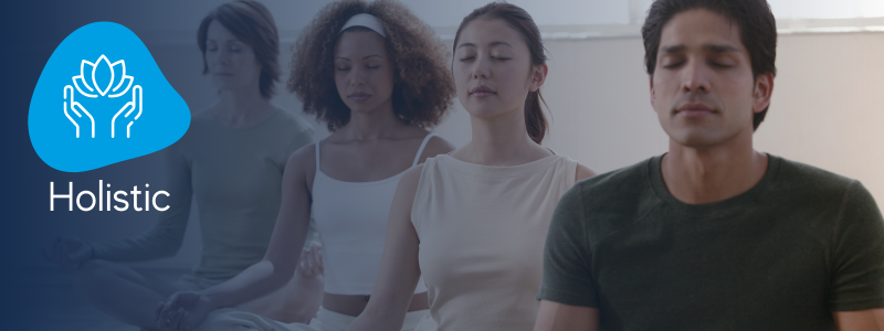 people performing a relaxation pose in a yoga class with a icon indicating a yoga holistic class