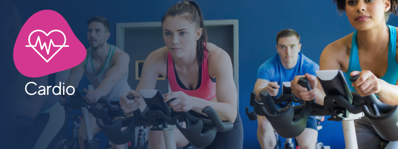 group of people on indoor cycling bikes with an icon indicating its a power ride cardio workout