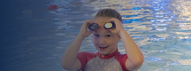 young girl in the pool in a family swimming session