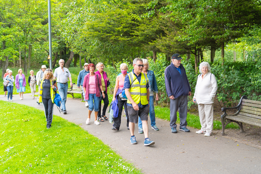 Group being led on a wellbeing walk in stanley park