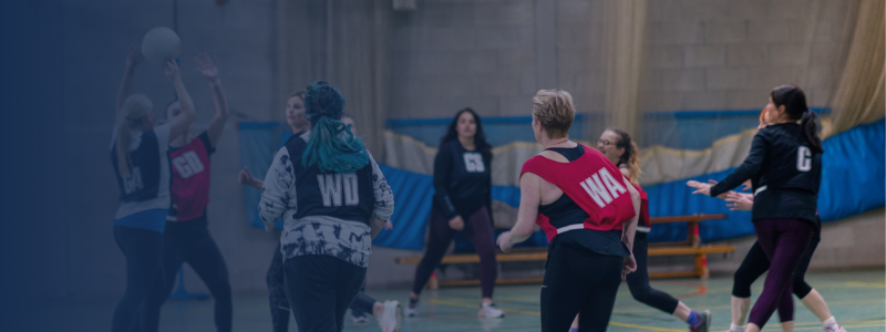 group of women playing netball together