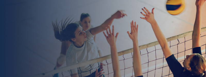 group of people playing volleyball